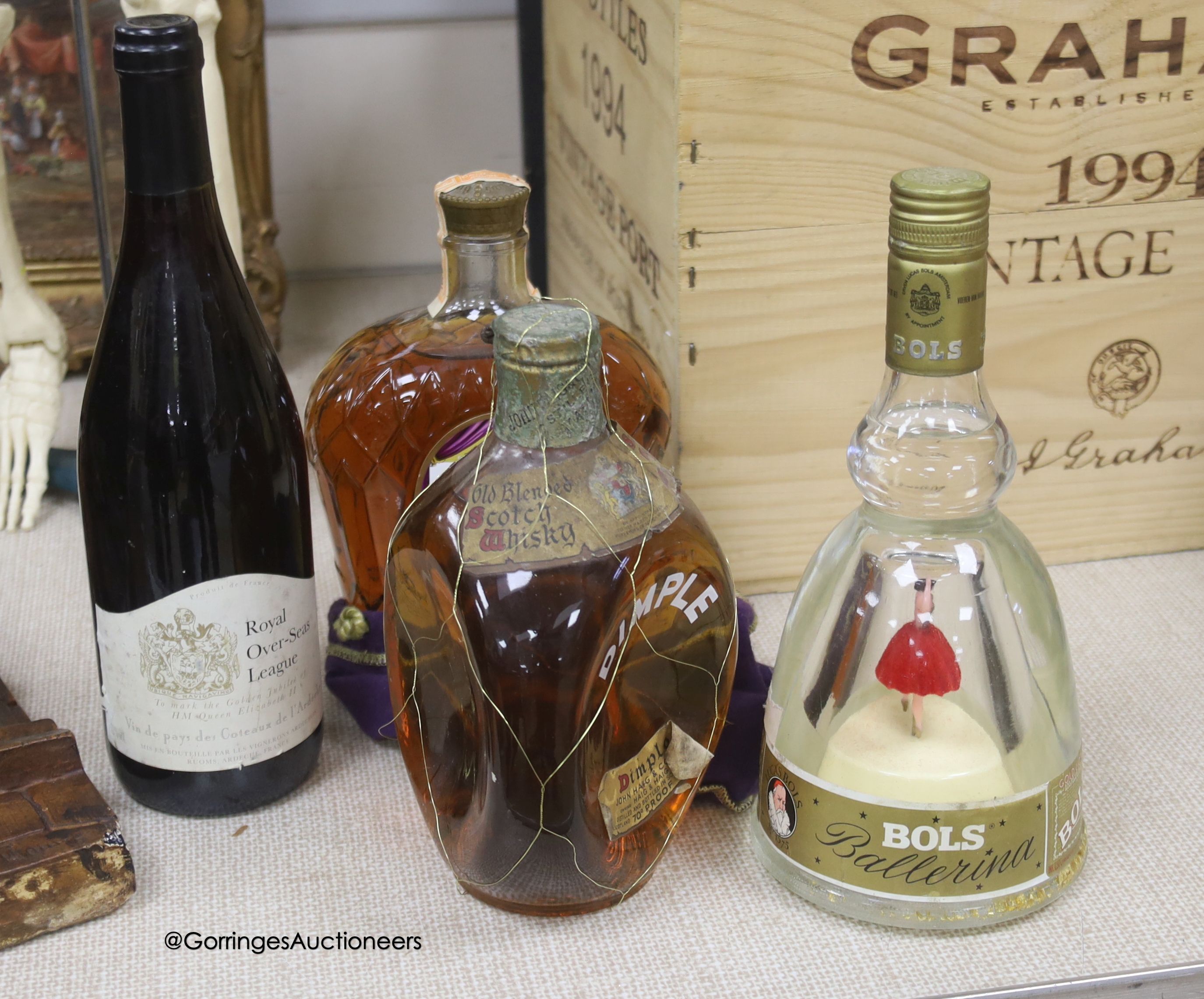One bottle of Haig Dimple Scotch Whisky, one Crown Royal Canadian Whisky, one Bols Ballerina and one Royal Over-seas (egue vin de pays wine)